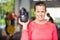 Fit Woman Lifting Kettlebell At Gym