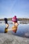 Fit woman performs ice swim in the ice hole