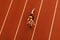 Fit woman on stadium red racetrack