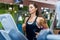 Fit woman working out jogging on treadmill at a gym.