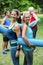 Fit women posing with sports mats back to back