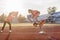 Fit women in the stadium playing leap frog.