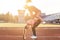 Fit women at the stadium playing leap frog.