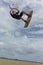 Fit young athlete shows off. Adventure sport kite surf freestyle performance