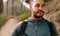 Fit young man standing on mountain trail