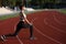 Fit young woman doing lunges