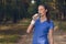 Fit young woman drinking bottled water