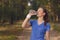 Fit young woman drinking bottled water