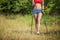 Fit young woman hiking with nordic walking poles