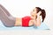 Fit young woman practicing abdominal exercises