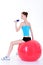 Fitball and doing exercise with dumbbells