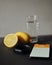 Fitnes tracker with smartphone lying on the table with water and lemon