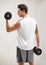 Fitness, back or athlete in dumbbell workout or training for wellness in studio on grey background. Strong man, model or