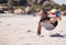 Fitness, beach and athlete playing volleyball while jumping on the sand while on tropical weekend trip. Sports, blur