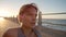 Fitness, beach and woman resting after a workout on the promenade for a maternity exercise. Sports, breathing and