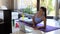 Fitness beautiful slim woman doing side plank and watching online tutorials.