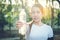 Fitness beautiful woman drinking water and sweating after exercising