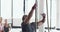 Fitness, bodybuilder and man climb rope for exercise, weightlifting and intense training in gym. Sports, challenge and