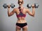 Fitness bodybuilder woman with dumbbells.blonde girl.gym