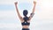 Fitness, celebration and woman with arms up in cloudy sky, mockup and winning achievement in nature. Ocean, goals and