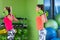 Fitness class with woman exercising. Females workout in gym with barbell.