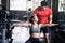 Fitness couple train with Dumbbells in gym