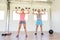 Fitness couple training dumbbell shoulder press