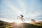 Fitness, cycling and person with bicycle jump for extreme sports and energy on blur mockup space . Action, bike and