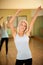 Fitness dance class aerobics. Women dancing happy energetic in g