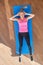 Fitness determined middle aged woman lying doing crunches at home on gym mat