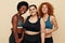 Fitness. Different Ethnicity Models Portrait. Smiling Diversity Women In Fitness Clothes Posing On Beige Background.