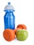 Fitness dumbbell, water bottle and apple isolated