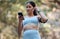 Fitness, earphones and woman with phone in nature for running music, radio or podcast outdoors. Health, wellness and