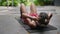 Fitness enthusiast performs crunches at outdoor gym focusing on core strength. Biethnic woman in workout gear engages in