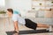 Fitness, exercise, lifestyle and healthy. Sports man do workout at home on mat in interior of living room