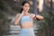 Fitness, exercise and woman with smartwatch to check pulse, progress and performance while outdoor for running and