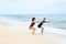 Fitness Exercises. Healthy Couple Squatting, Exercising On Beach