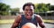 Fitness, face and screaming man with basketball passion, energy and mindset at outdoor court. Sports, freedom and