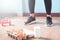 Fitness female in black pants standing on wood floor with dumbbells and dairy product for workout