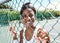 Fitness, fence or portrait of black woman on a tennis court relaxing on training, exercise or workout break in summer