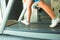 Fitness girl running on treadmill. Woman in gym