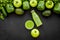 Fitness greeny drink with vegetables on dark background top view mock-up