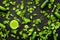 Fitness greeny drink with vegetables on dark background top view mock-up