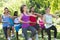 Fitness group doing tai chi in park