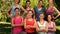 Fitness group smiling at camera in park