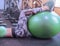 Fitness gym girl goes in for sports with a green ball.