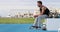 Fitness gym man relaxing during training exercises outdoors at Athletics stadium outdoor gym. Male athlete.