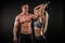 Fitness in gym, sport and healthy lifestyle concept. Couple of athletic man and woman showing their trained bodies on