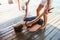 Fitness instructor assisting young woman in stretching exercise