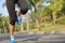 Fitness jogger legs running at tropical park